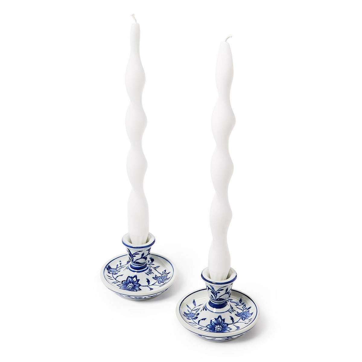 Two chinoiserie candleholders with white twist taper candles