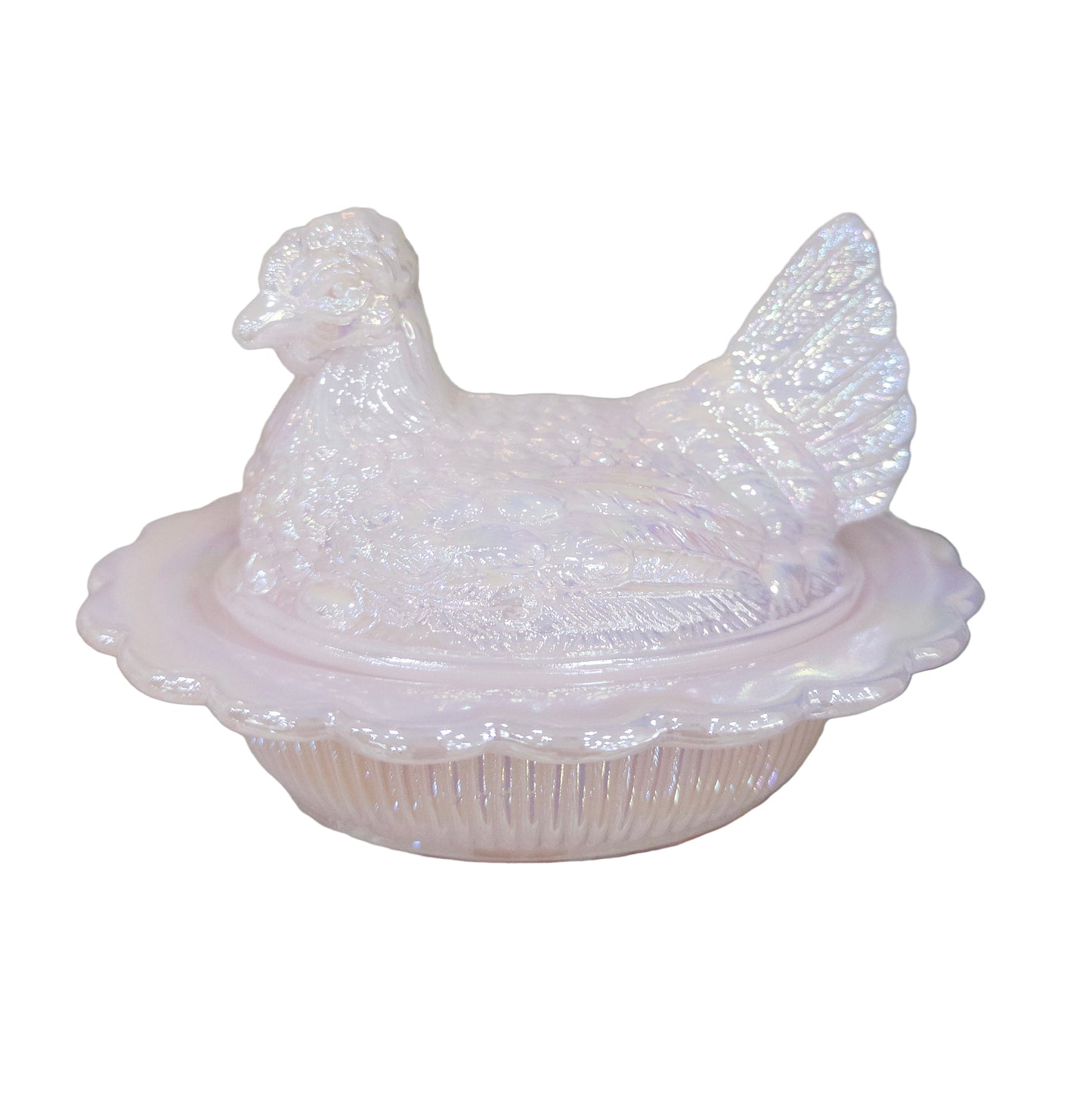 Decorative pink ceramic chicken with a lid on a glass surface