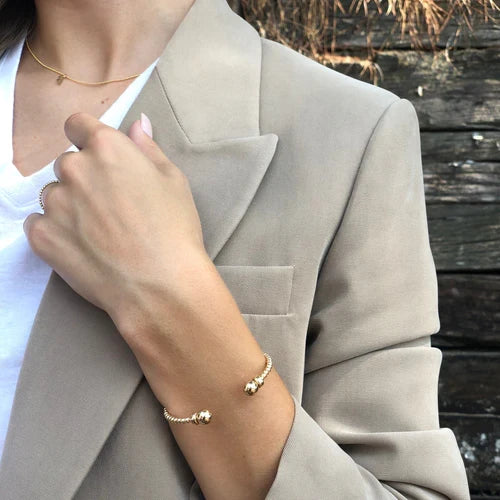 enewton gold bead cuff bracelet worn with a neutral blazer