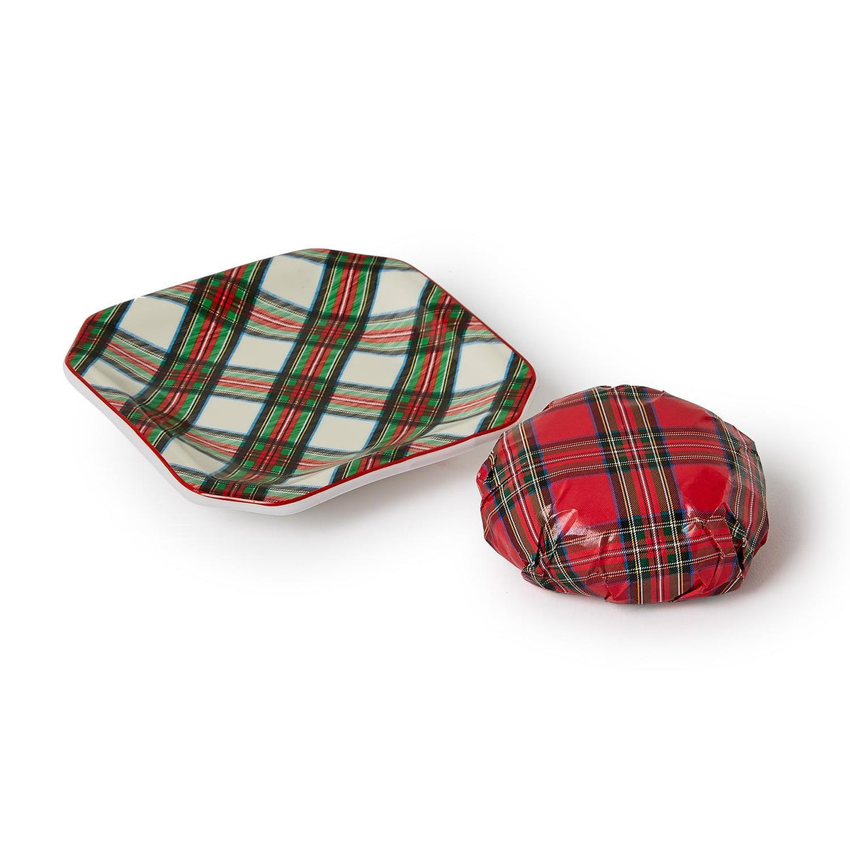 Red tartan wrapped soap bar beside the green and red plaid porcelain soap dish