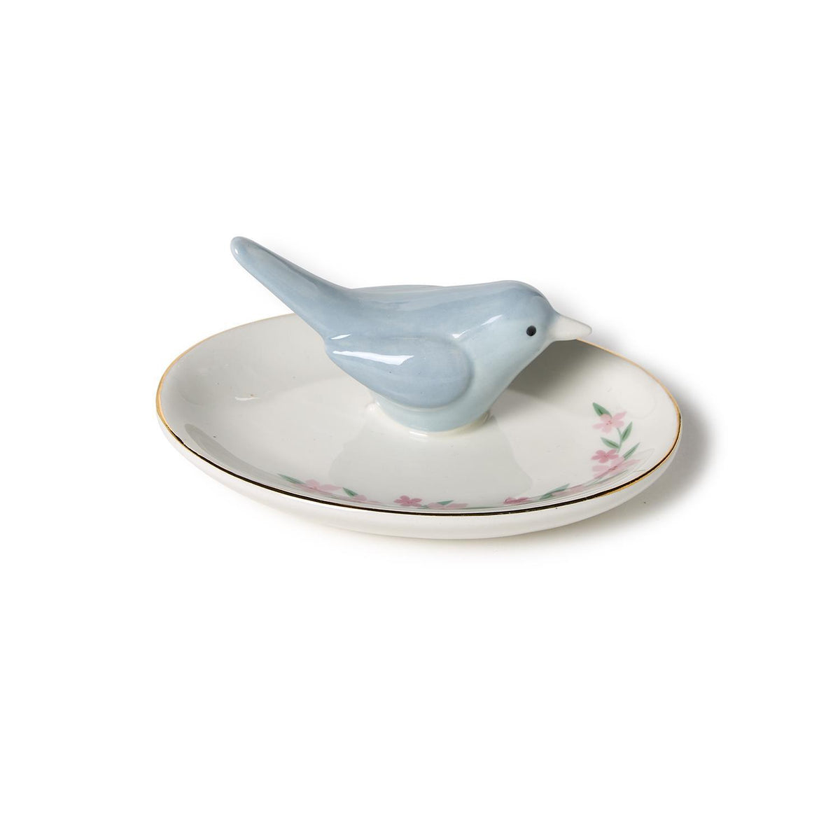 Blue bird ring holder on a white dish