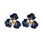 Fornash Gardenia Earrings in navy - pearl petal flower earrings with gold and crystal center