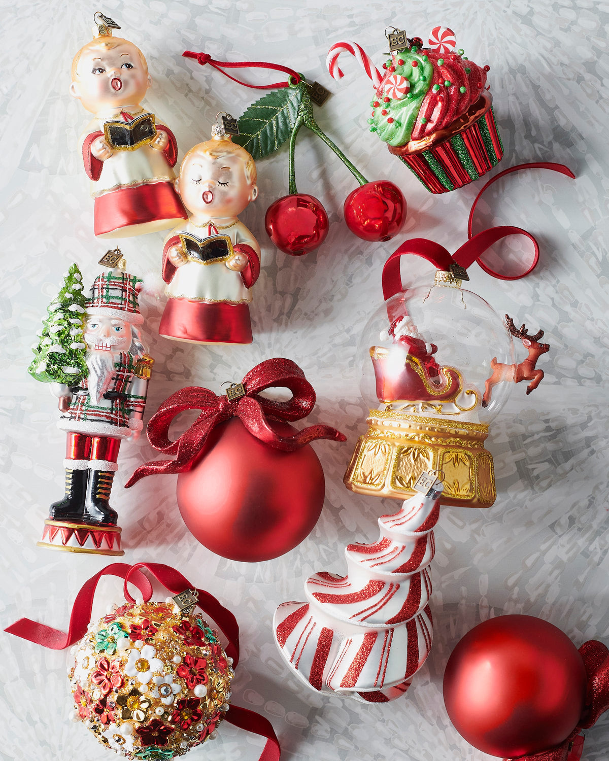 Plaid nutcracker glass ornament shown with other Christmas ornaments (sold separately)