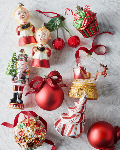 Plaid nutcracker glass ornament shown with other Christmas ornaments (sold separately)
