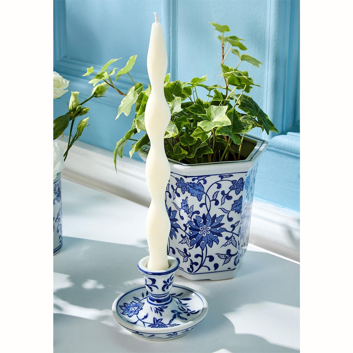 Chinoiserie taper candleholder styled with blue and white vases