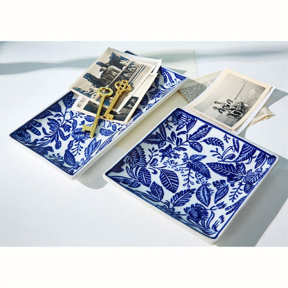 Chinoiserie trinket trays holding photos and keys