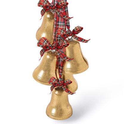 Close-up of gold bells with plaid ribbon bows