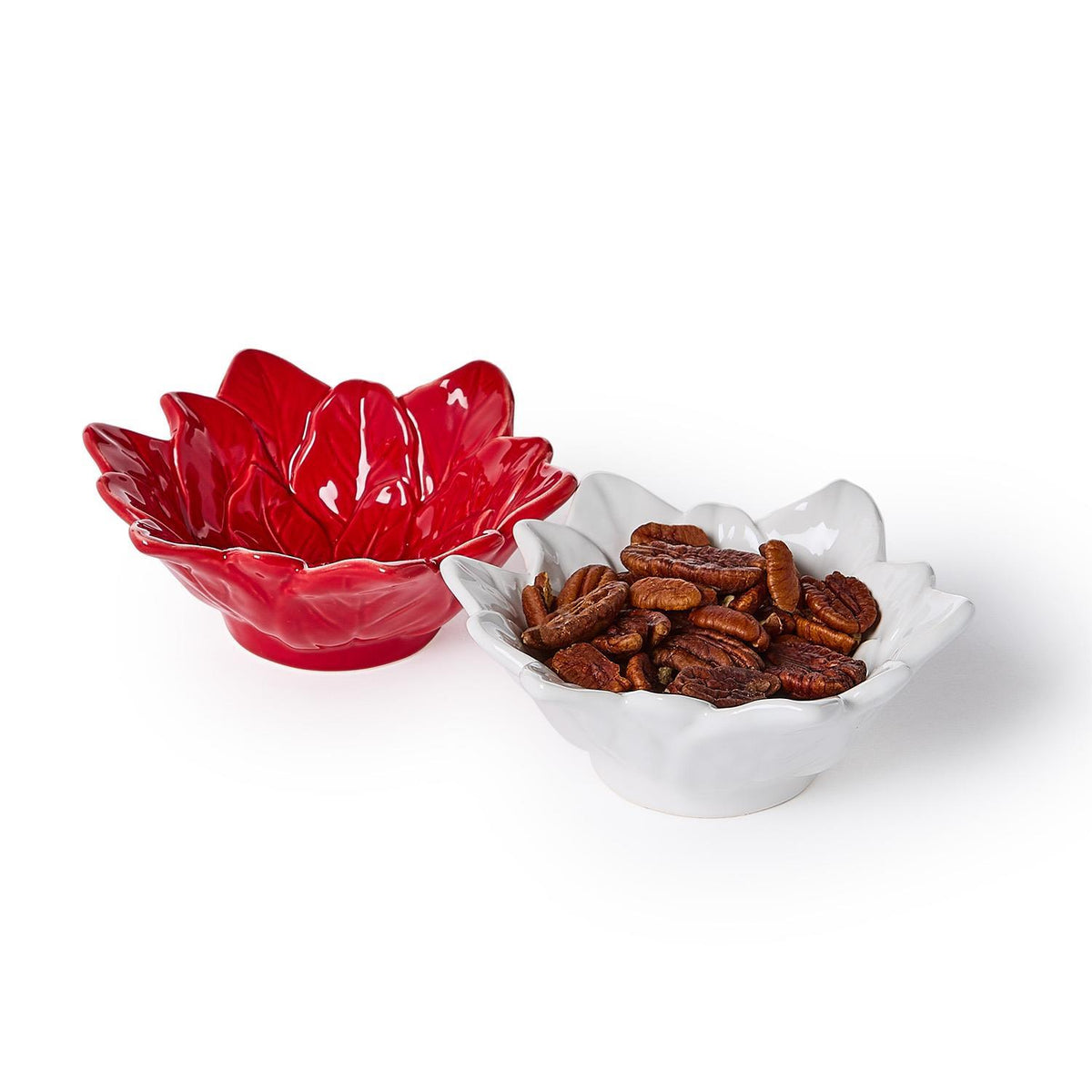 Red and white ceramic poinsettia tidbit dishes, one filled with pecans