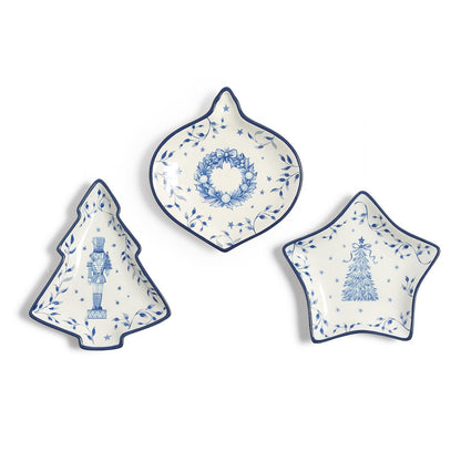 Three blue and white porcelain Christmas tidbit dishes shaped like a tree, ornament and star