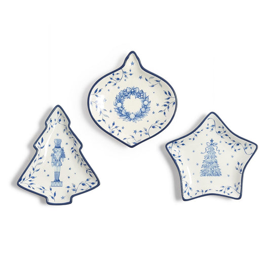 Three blue and white porcelain Christmas tidbit dishes shaped like a tree, ornament and star