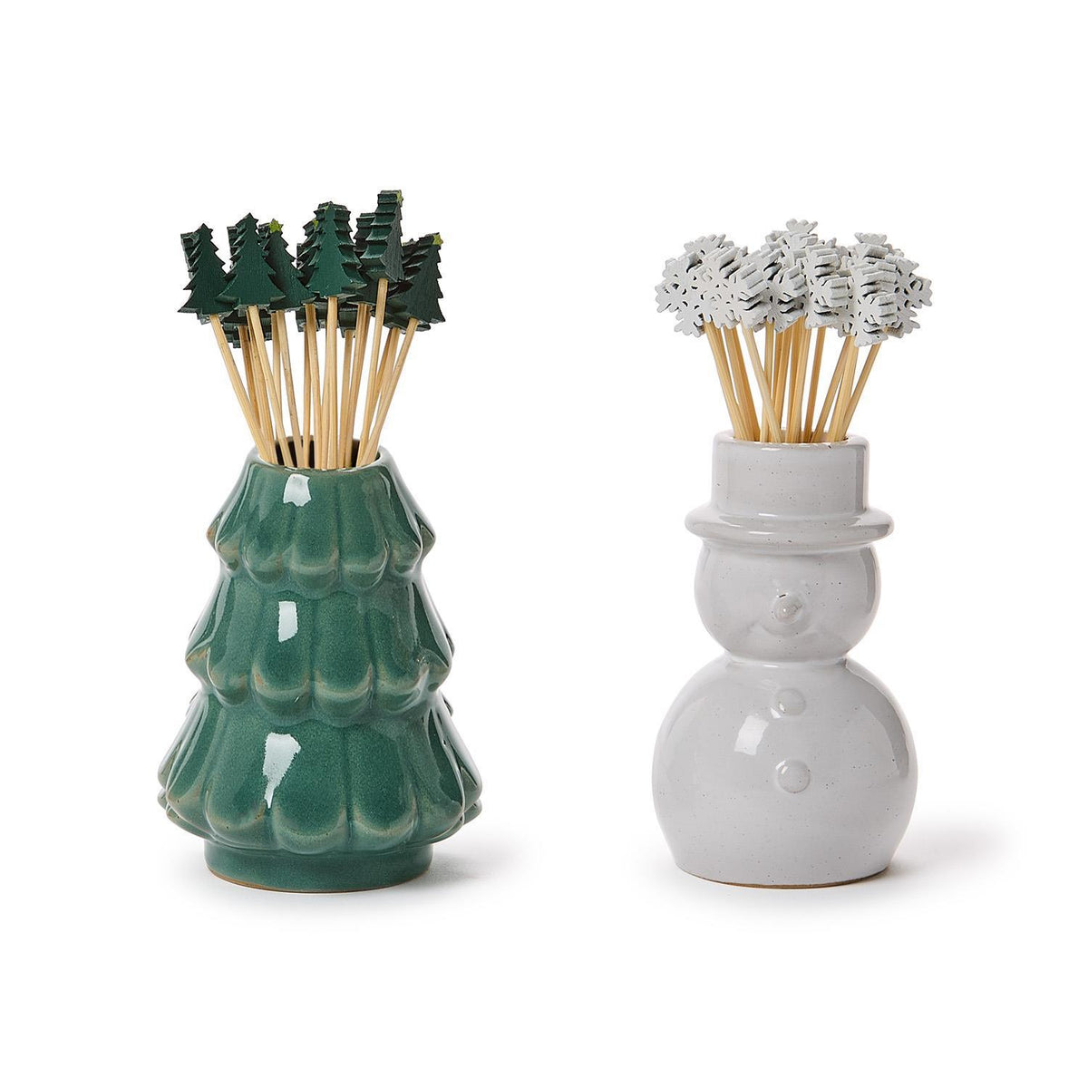Green ceramic Christmas tree and white snowman cocktail pick holders filled with festive picks
