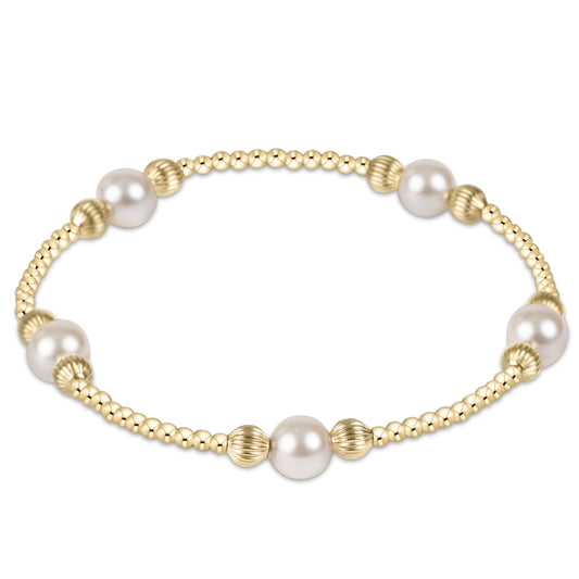 enewton Purpose Pearl 6mm Dignity Gold Beaded Bracelet shown flat on a plain white background