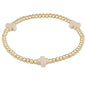 enewton Signature Cross 3mm Gold Beaded Bracelet in Off-White shown flat on a plain white background