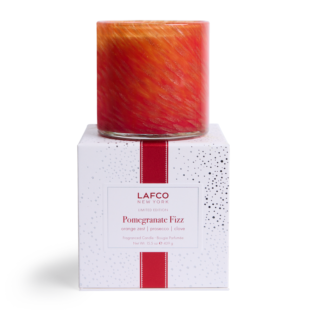 LAFCO Pomegranate Fizz Signature Candle 15.5 oz - red and orange hand-blown glass vessel on its white LAFCO gift box