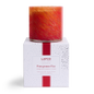 LAFCO Pomegranate Fizz Signature Candle 15.5 oz - red and orange hand-blown glass vessel on its white LAFCO gift box