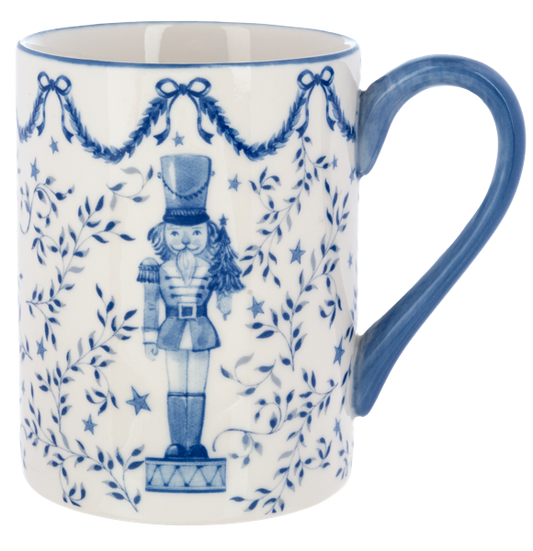 Cobalt blue nutcracker soldier on a white porcelain mug with a blue handle