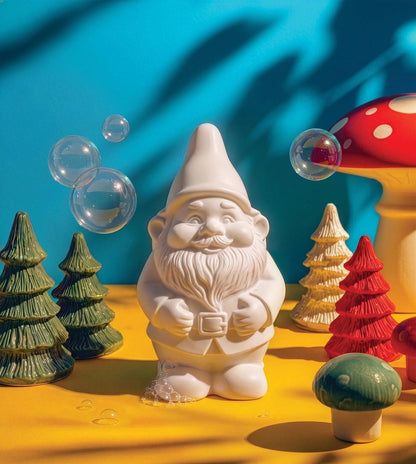 Close-up of the gnome-shaped Swedish Pine soap with soap bubbles and paper trees
