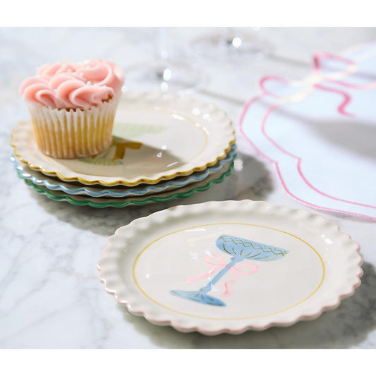Pink rose cupcake served on a hand-painted coupe glass tidbit plate