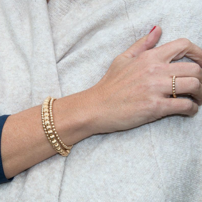 enewton Classic Gold 2mm Bead Ring in Size 7 worn on a hand