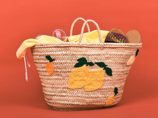 Woven basket with fruit patterns on a red background