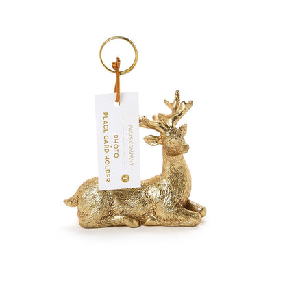 Golden deer holder displaying a gift tag