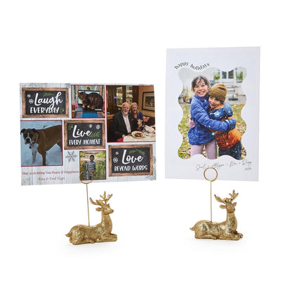 Golden deer holders displaying Christmas cards and family photos