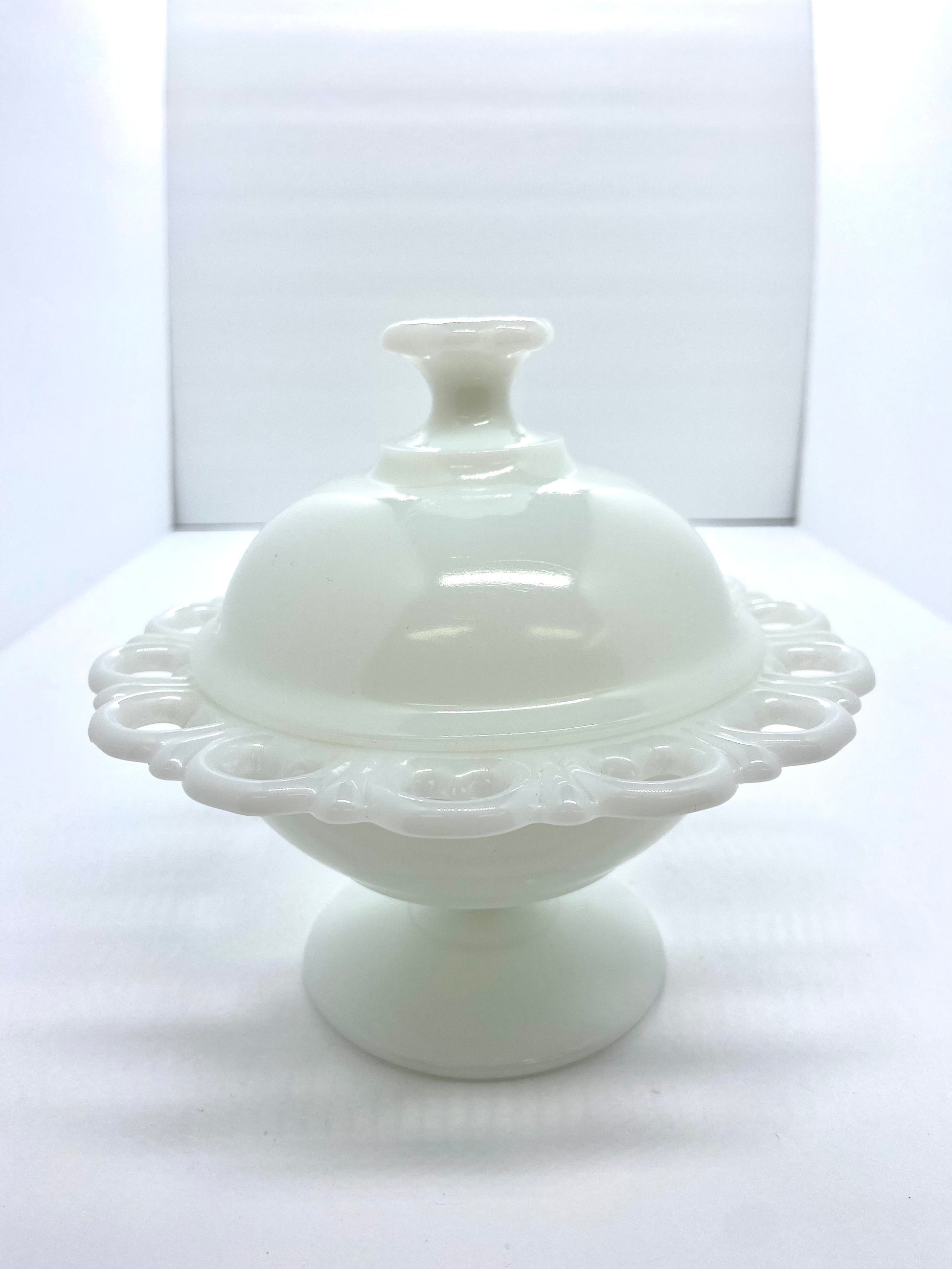 Sold at Auction: MILK GLASS CANDY DISH AND VASES